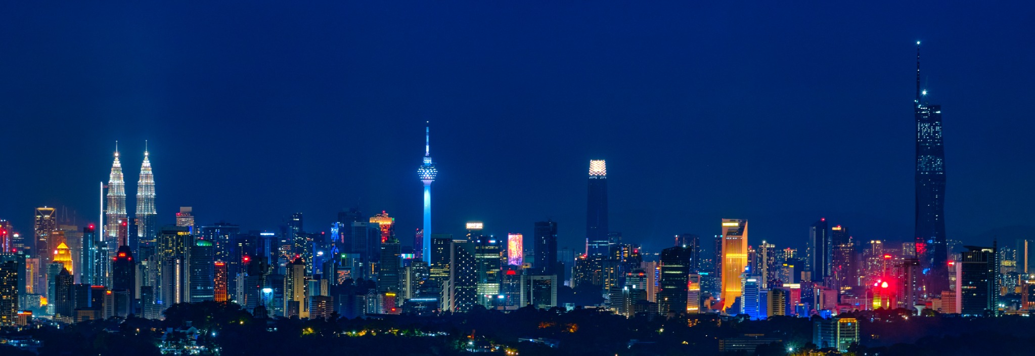 Skyline of Kuala Lumpur with the Petronas Twin Towers at dusk