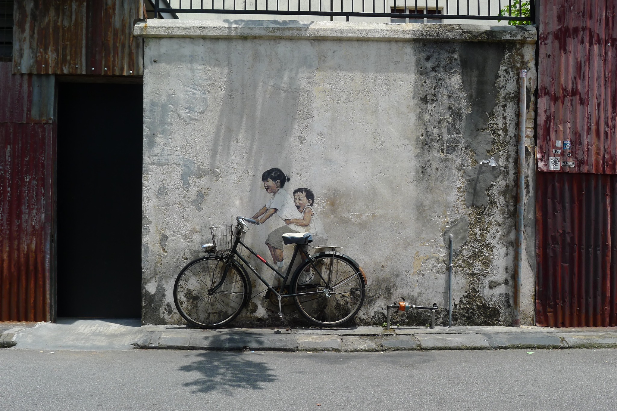 Street art murals on heritage shophouses in George Town, Penang